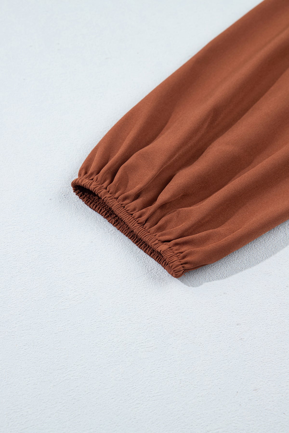 Jet Stream Solid Color Smocked Ruffle Hem Long Sleeve Blouse